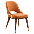 Chaise de salle à manger Falqorin en similicuir cognac, style contemporain, dimensions 58x60x82 cm, assise rembourrée élégante.